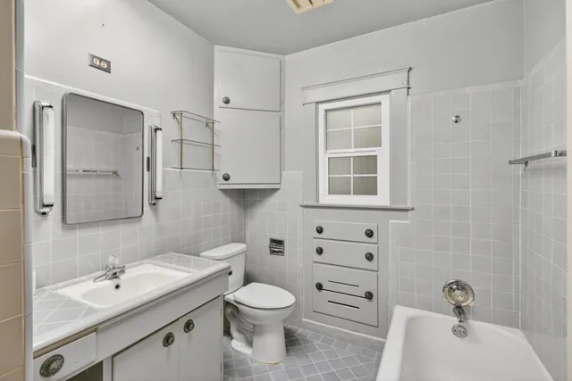 an aerial view of a houses with city view