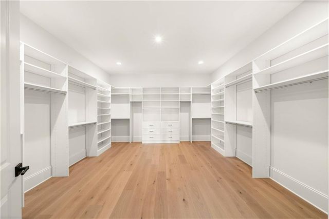 a room with closet and wooden floor