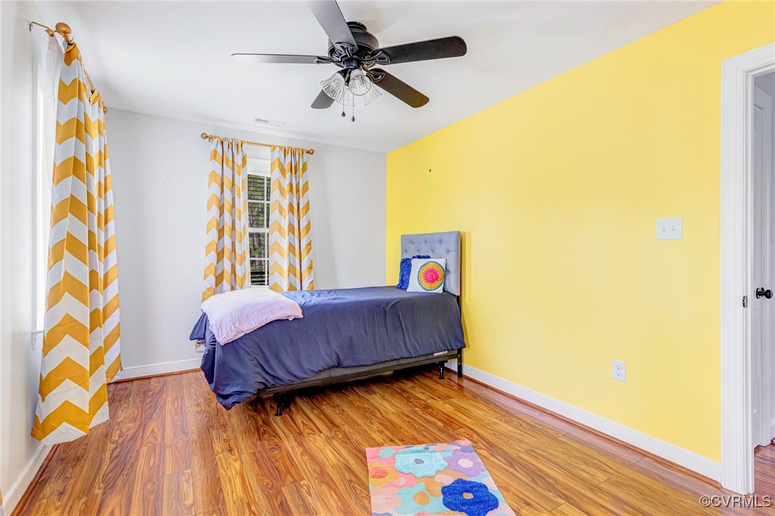 8773 Rock Cedar Road New Kent, VA 23124 - Photo 21 of 37 Bedroom w/wood finished floors & a ceiling fan