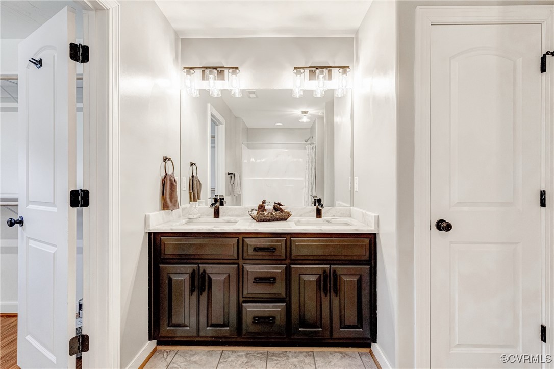 8773 Rock Cedar Road New Kent, VA 23124 - Photo 28 of 37 Primary Full bathroom featuring a double vanity, a