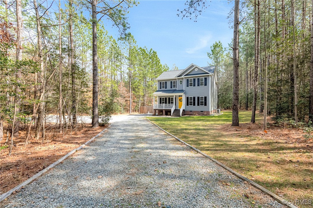 8773 Rock Cedar Road New Kent, VA 23124 - Photo 3 of 37 Colonial house featuring a shingled roof, a forest