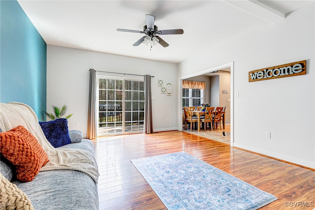 8773 Rock Cedar Road New Kent, VA 23124 - Photo 7 of 37 Family Room with wood finished floors & ceiling fa