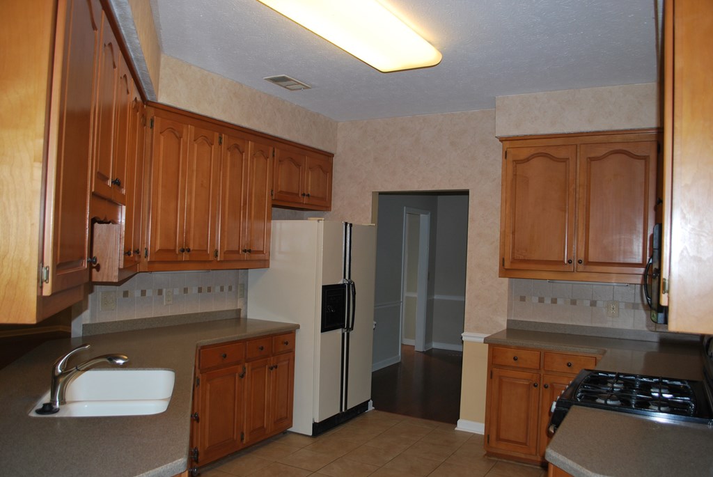 763 Double Churches Road Columbus, GA 31904 - Photo 6 of 26 Abundant Storage & Corian Countertops