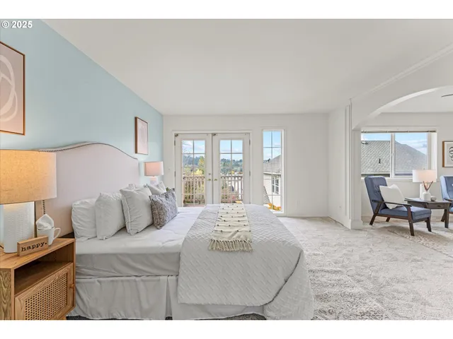 a bedroom with a bed and a couch