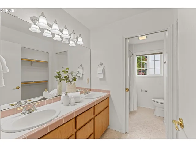 a bathroom with a sink vanity and a mirror