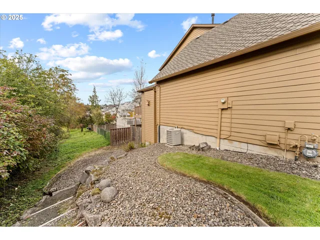 a view of a backyard of the house