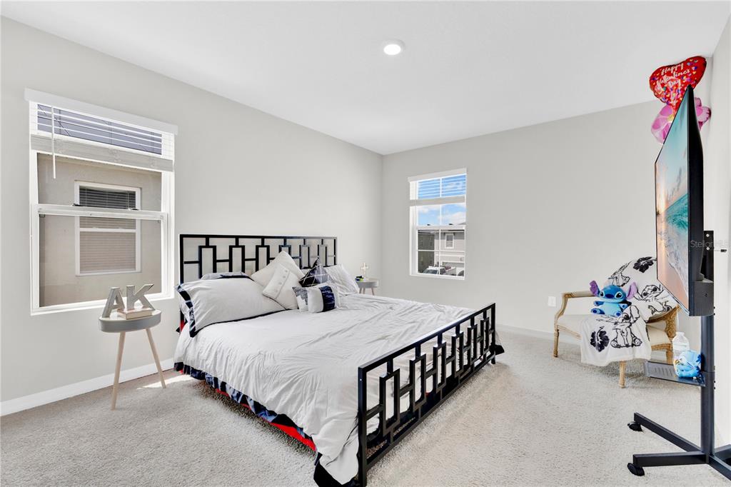 167 Eagleview Loop Davenport, FL 33837 - Photo 11 of 39 a bedroom with a bed and a window