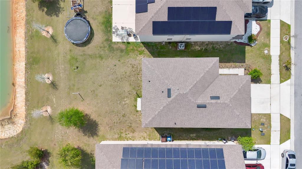 167 Eagleview Loop Davenport, FL 33837 - Photo 26 of 39 an aerial view of a house with swimming pool and large trees