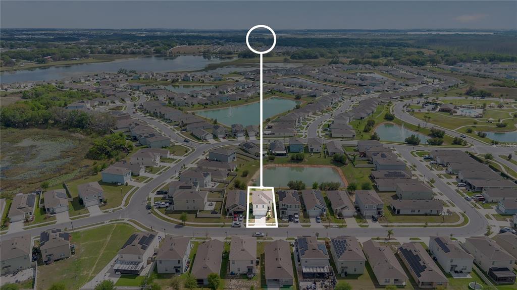 167 Eagleview Loop Davenport, FL 33837 - Photo 29 of 39 a front view of a house with garden space