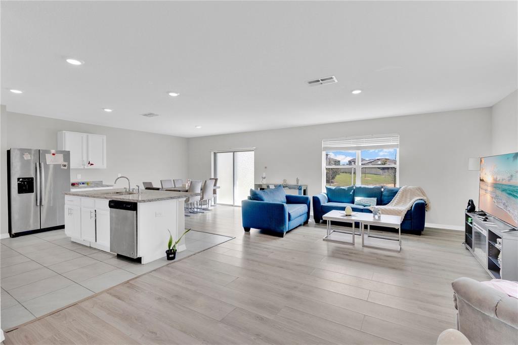 167 Eagleview Loop Davenport, FL 33837 - Photo 3 of 39 a living room with furniture and a wooden floor