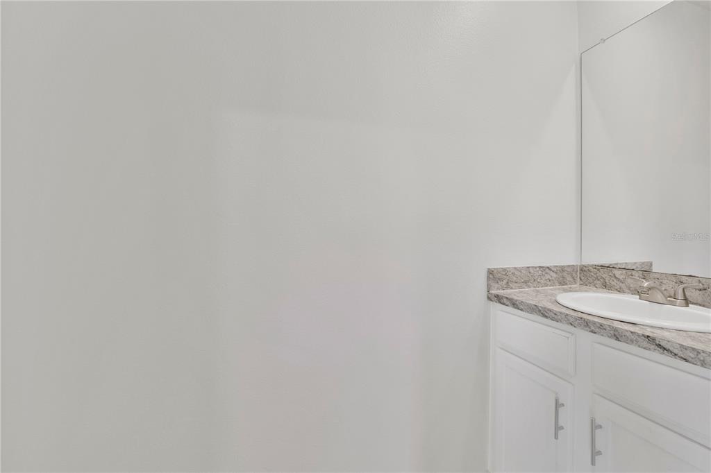 167 Eagleview Loop Davenport, FL 33837 - Photo 5 of 39 a bathroom with a sink and vanity