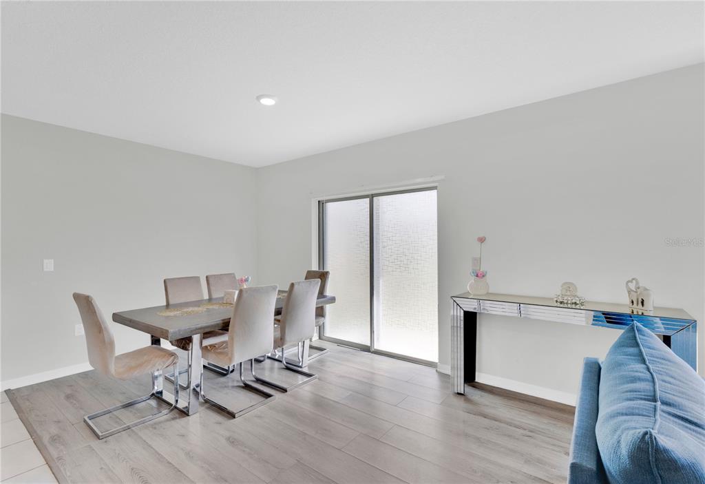 167 Eagleview Loop Davenport, FL 33837 - Photo 8 of 39 a workspace with furniture and wooden floor