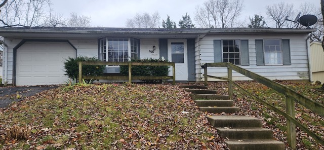 910 Timberline Drive Danville, IL 61832 - Photo 1 of 11 a view of a house with wooden fence and a bench