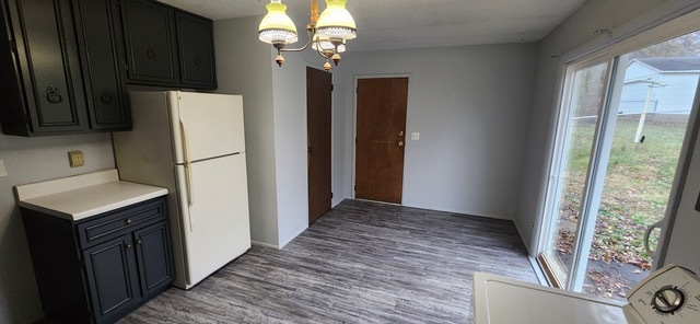 910 Timberline Drive Danville, IL 61832 - Photo 5 of 11 a view of a kitchen with a sink dishwasher and wooden floor