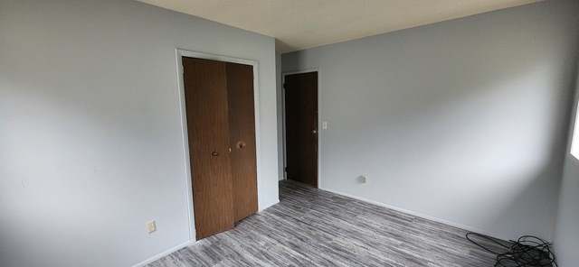 910 Timberline Drive Danville, IL 61832 - Photo 8 of 11 a view of an empty room with wooden floor