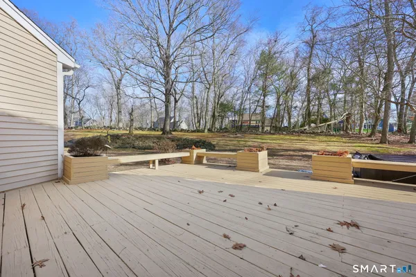 a view of a yard with wooden floor