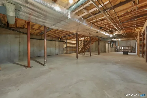 a view of empty room with wooden ceiling