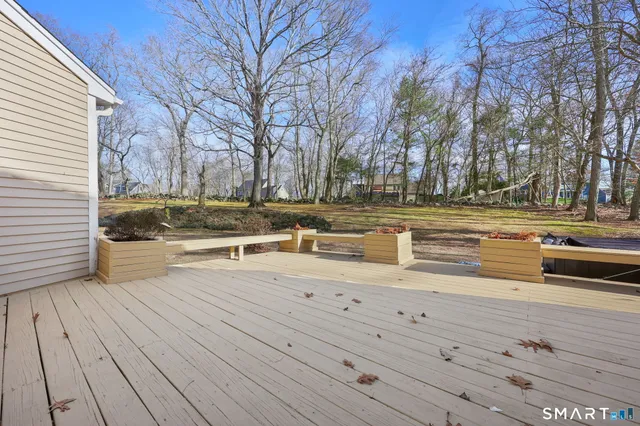 a view of a yard with wooden floor