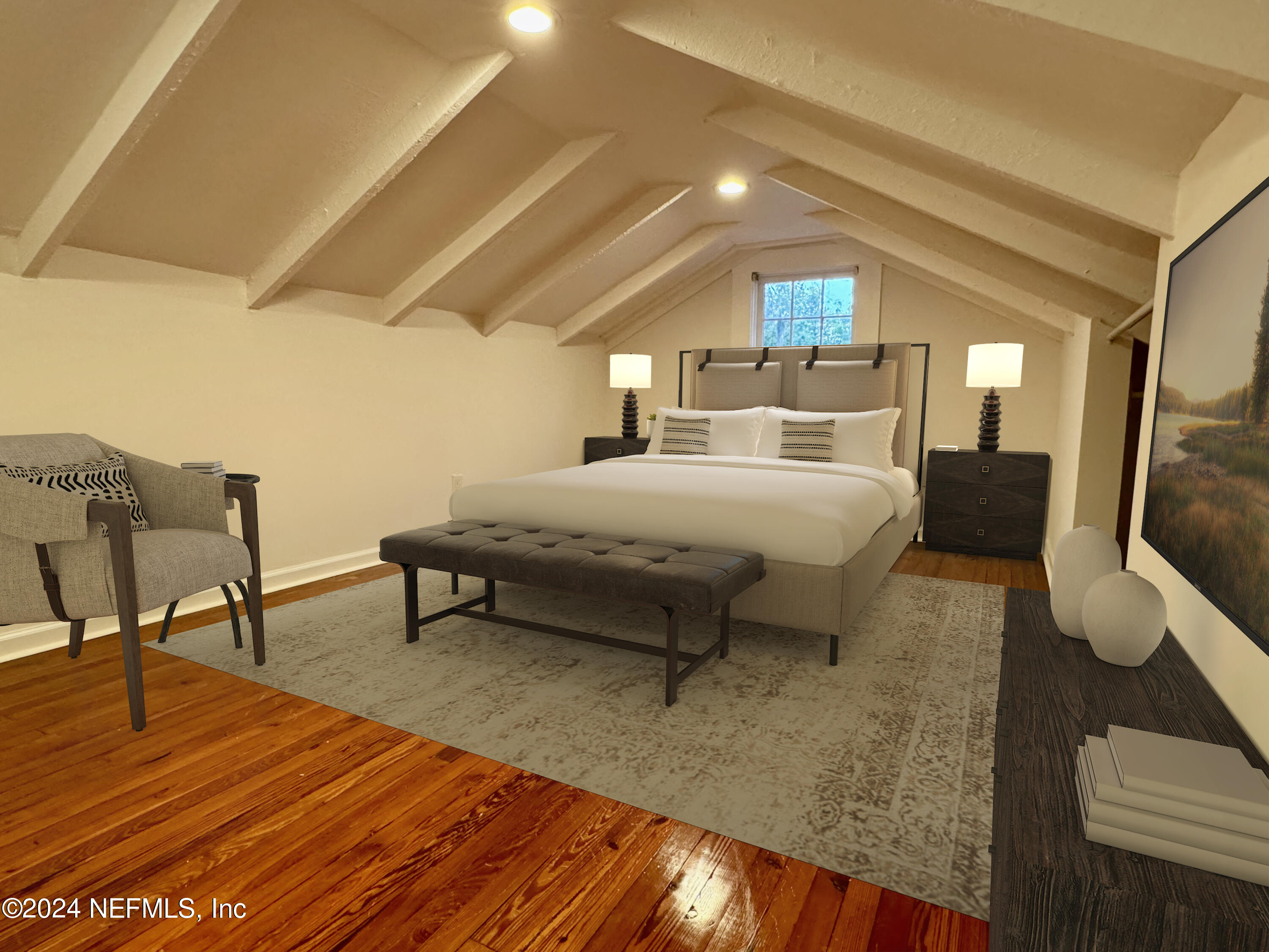 a spacious bedroom with a bed a couch and dresser