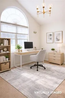 a view of a workspace with furniture