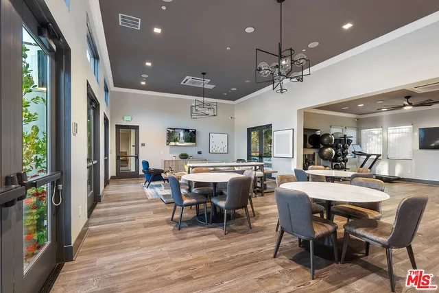 a view of a dining area with furniture window and wooden floor