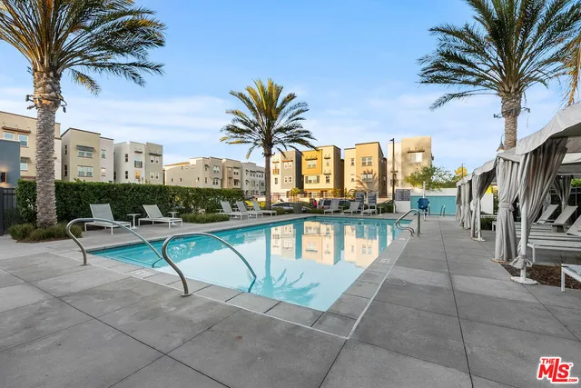 a view of swimming pool with chairs