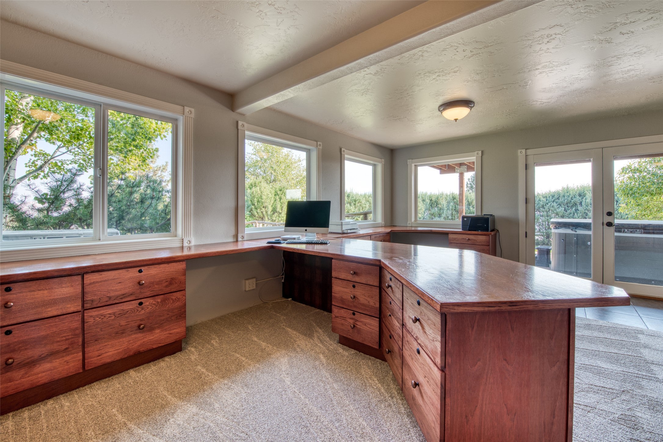 16374 Folsom Road Florence, MT 59833 - Photo 89 of 98 Home office featuring light carpet, french doors, and a textured ceiling