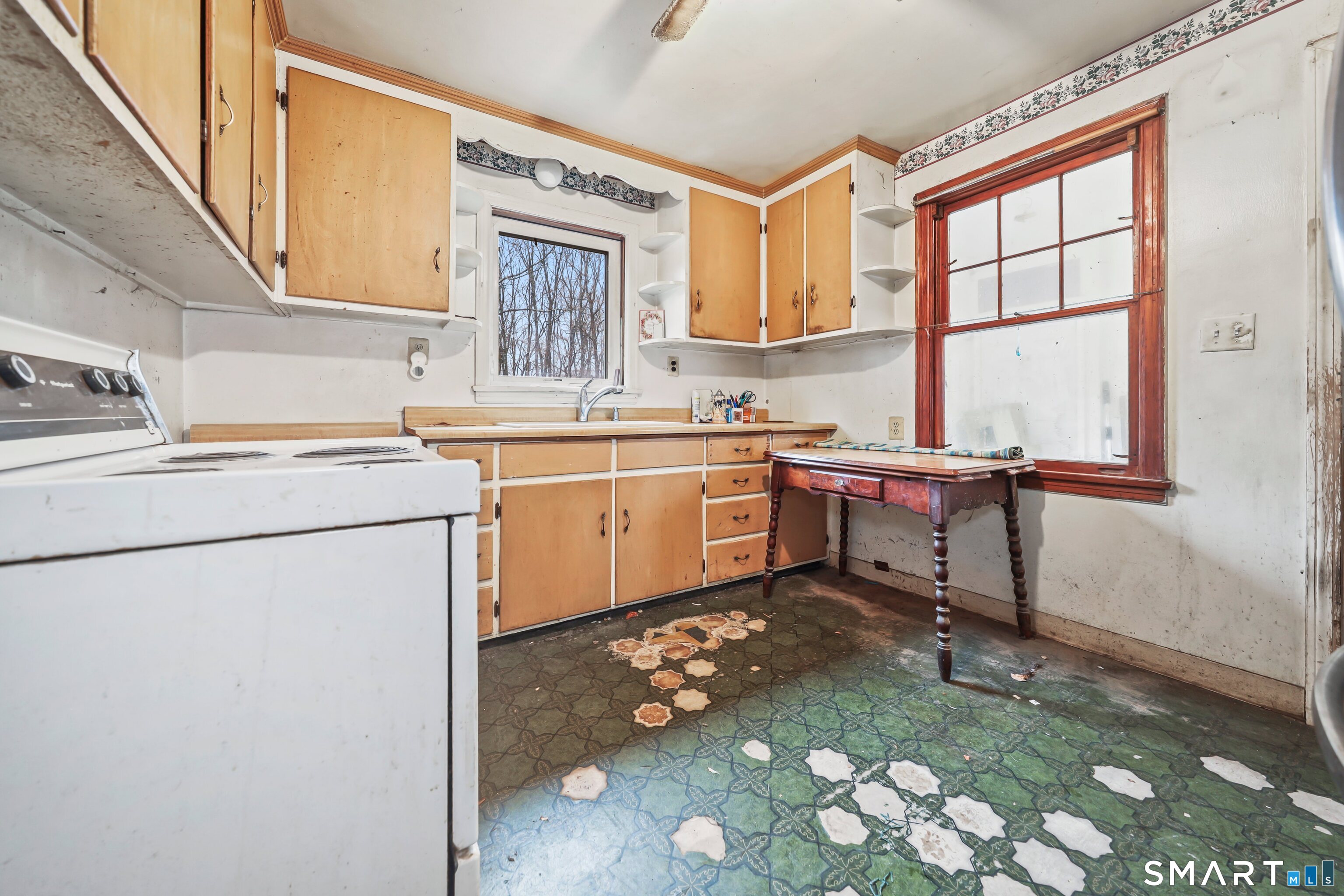 76 Clark Hill Road Prospect, CT 06712 - Photo 16 of 44 a kitchen with a sink cabinets and window