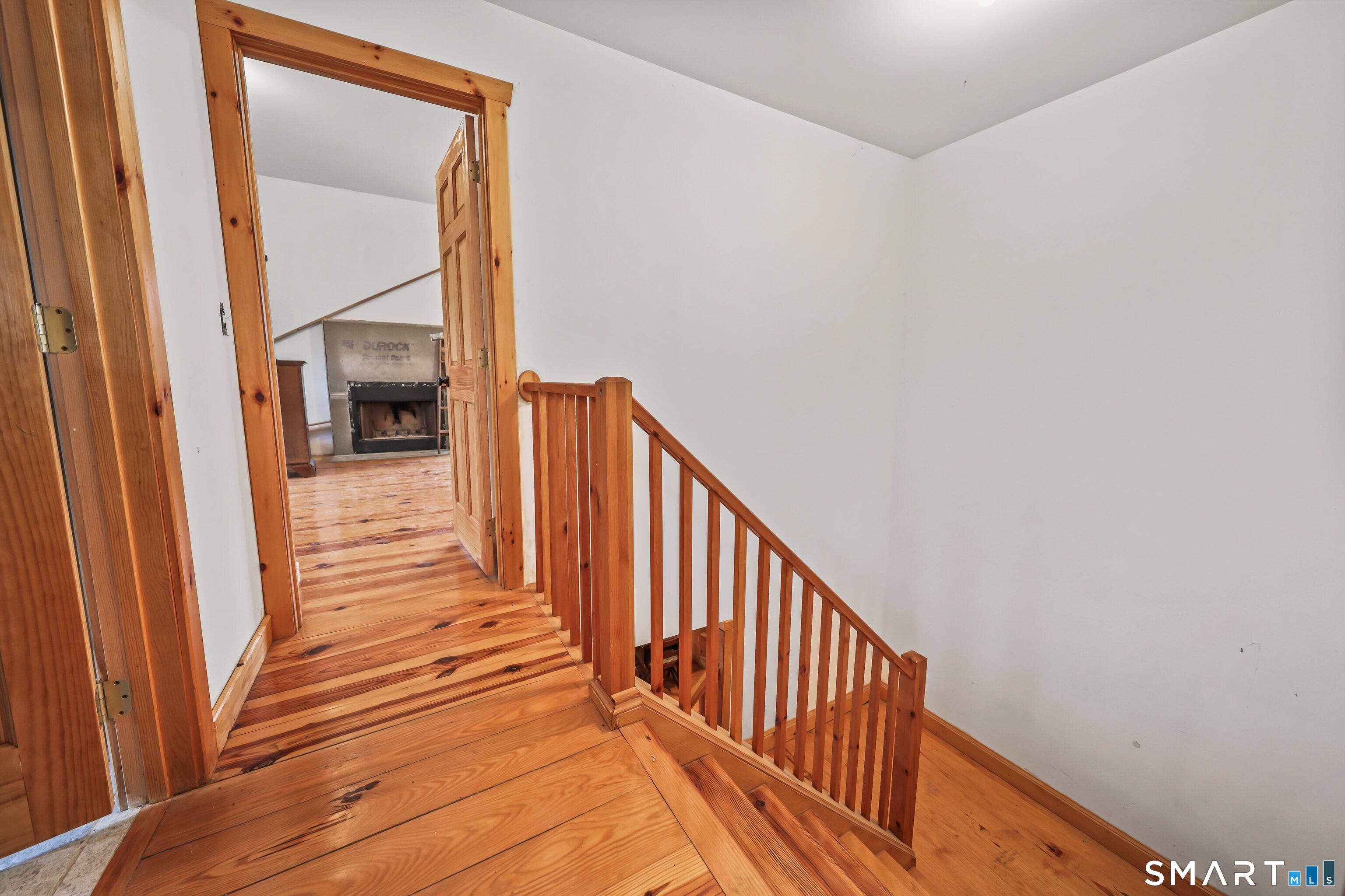 76 Clark Hill Road Prospect, CT 06712 - Photo 21 of 44 a view of a hallway with wooden floor and staircase