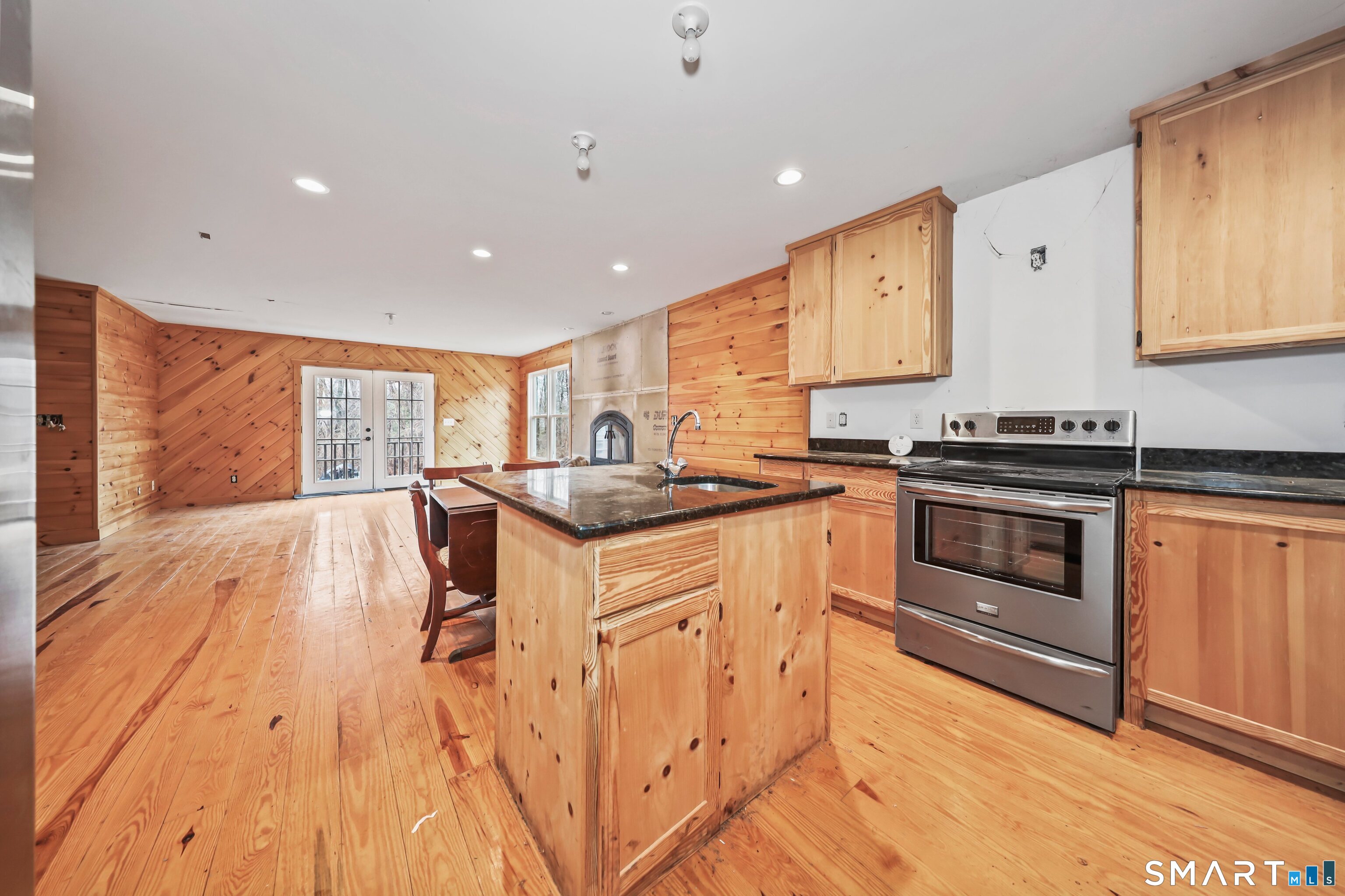 76 Clark Hill Road Prospect, CT 06712 - Photo 38 of 44 a kitchen with stainless steel appliances granite countertop a stove and a refrigerator