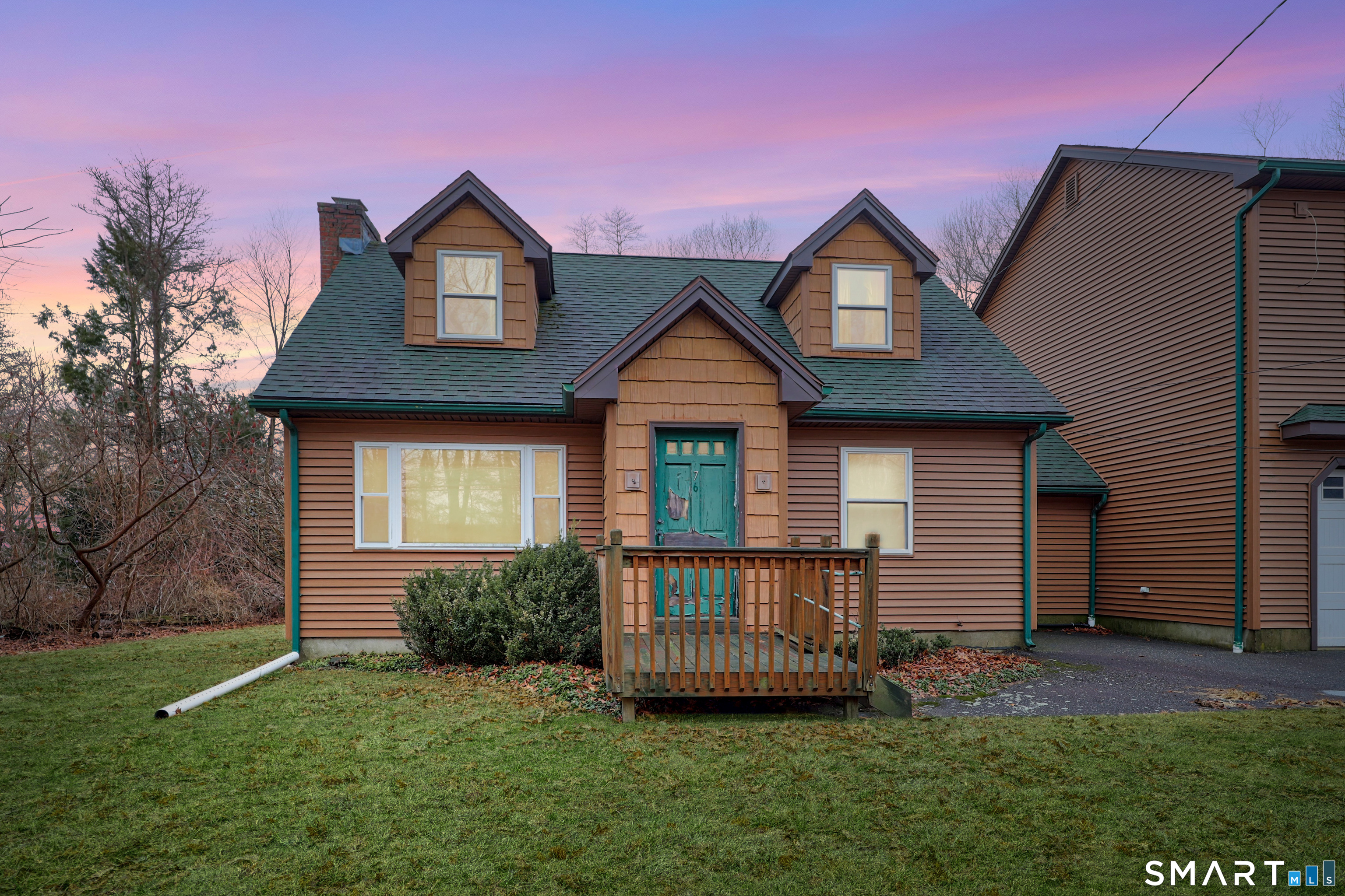 76 Clark Hill Road Prospect, CT 06712 - Photo 4 of 44 a front view of a house with a garden and yard