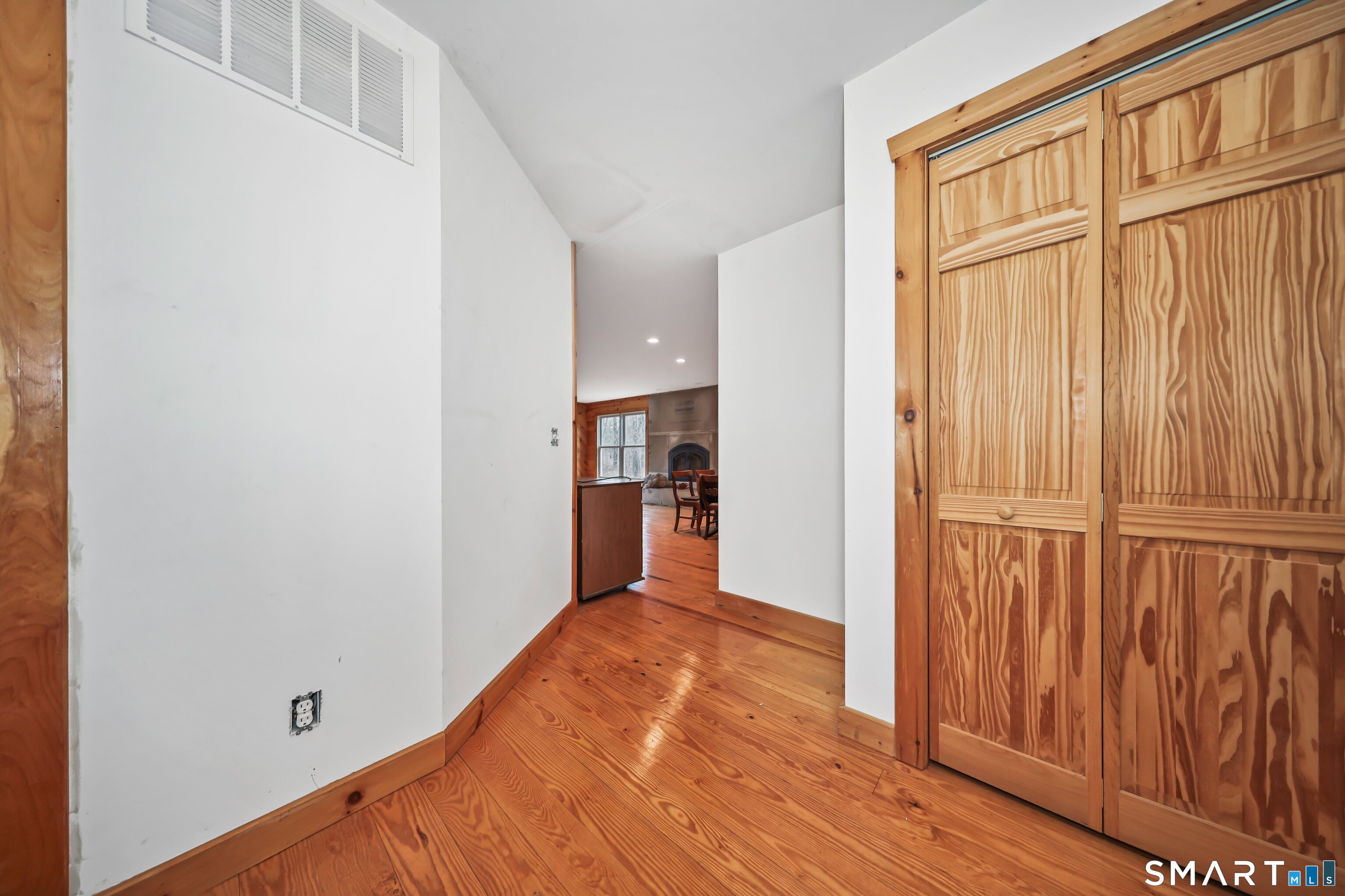 76 Clark Hill Road Prospect, CT 06712 - Photo 41 of 44 a view of an empty room with wooden floor