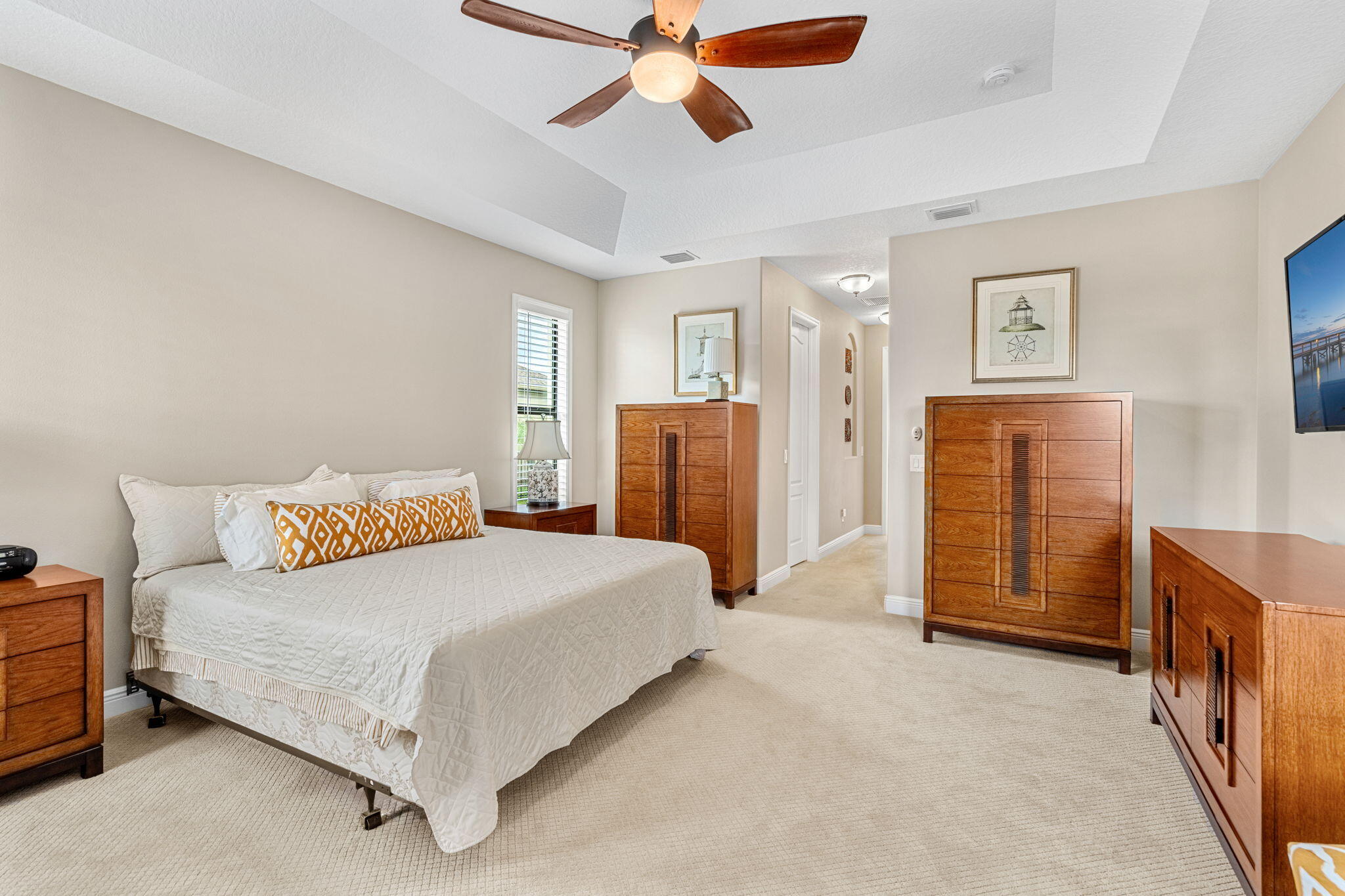 2911 Addison Drive Melbourne, FL 32940 - Photo 12 of 36 a bedroom with a bed closet and dresser