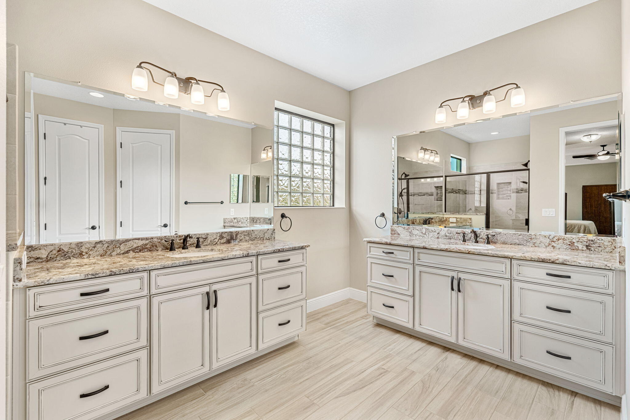 2911 Addison Drive Melbourne, FL 32940 - Photo 13 of 36 a bathroom with a granite countertop double vanity sink and mirror