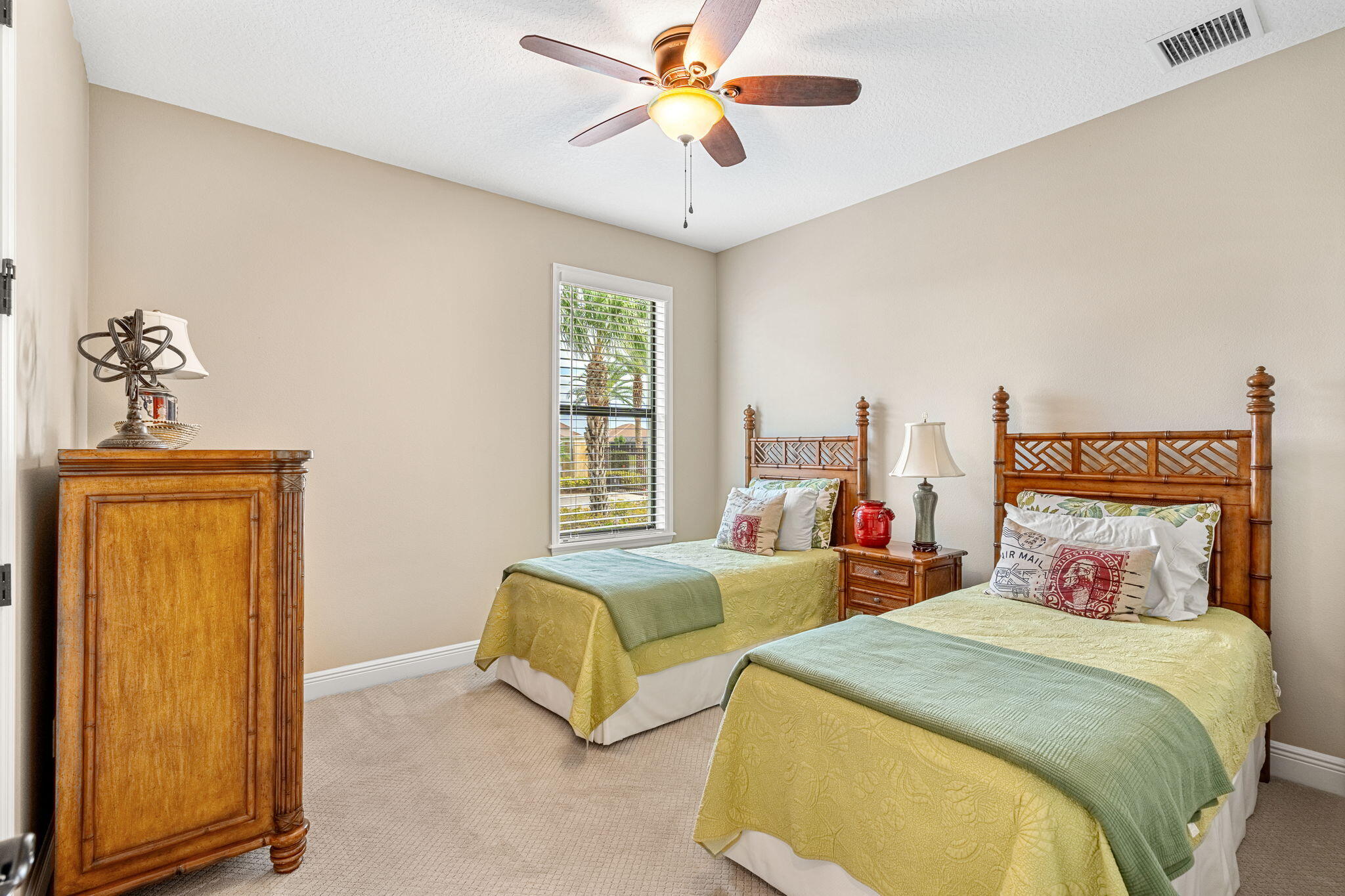 2911 Addison Drive Melbourne, FL 32940 - Photo 17 of 36 a bedroom with two beds and a window