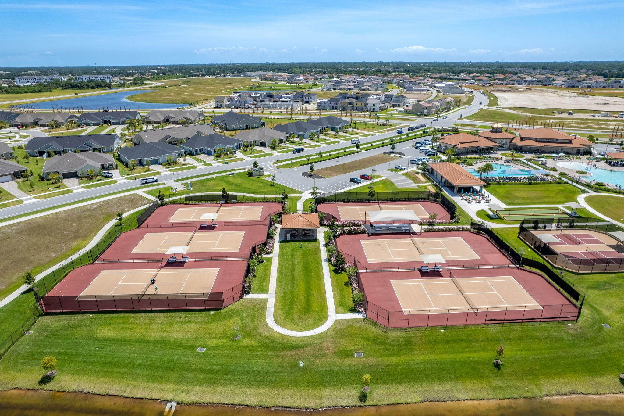 2911 Addison Drive Melbourne, FL 32940 - Photo 34 of 36 an aerial view of residential houses with outdoor space and swimming pool