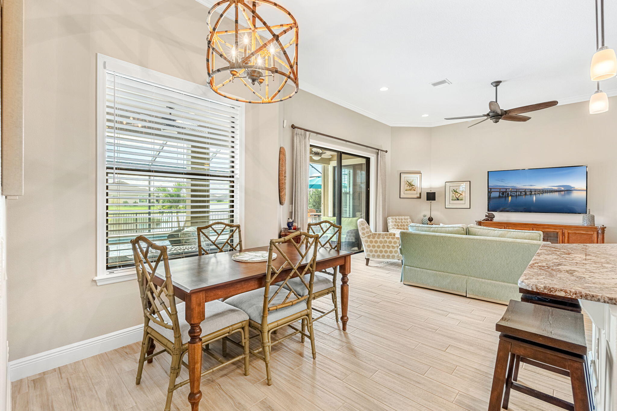 2911 Addison Drive Melbourne, FL 32940 - Photo 7 of 36 a dining room with furniture and wooden floor