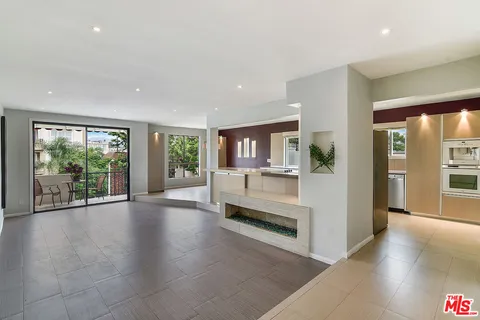 a view of an entryway with wooden floor and windows