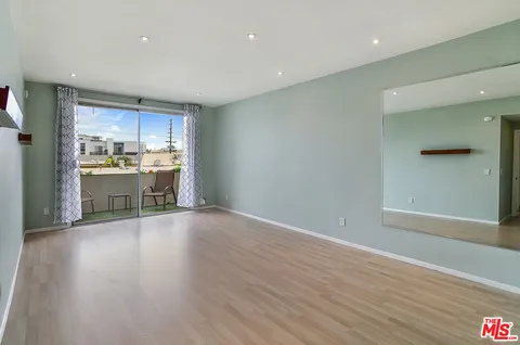 a view of a kitchen with a sink and a stove top oven