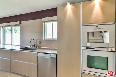 a kitchen with a sink and a microwave