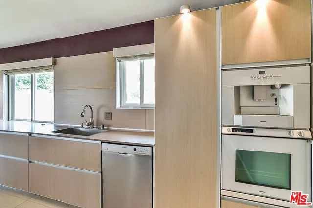 a kitchen with a sink and a microwave