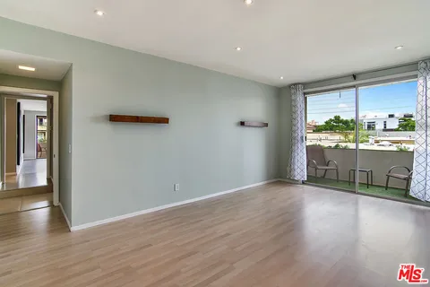 a view of a kitchen with a sink and a window