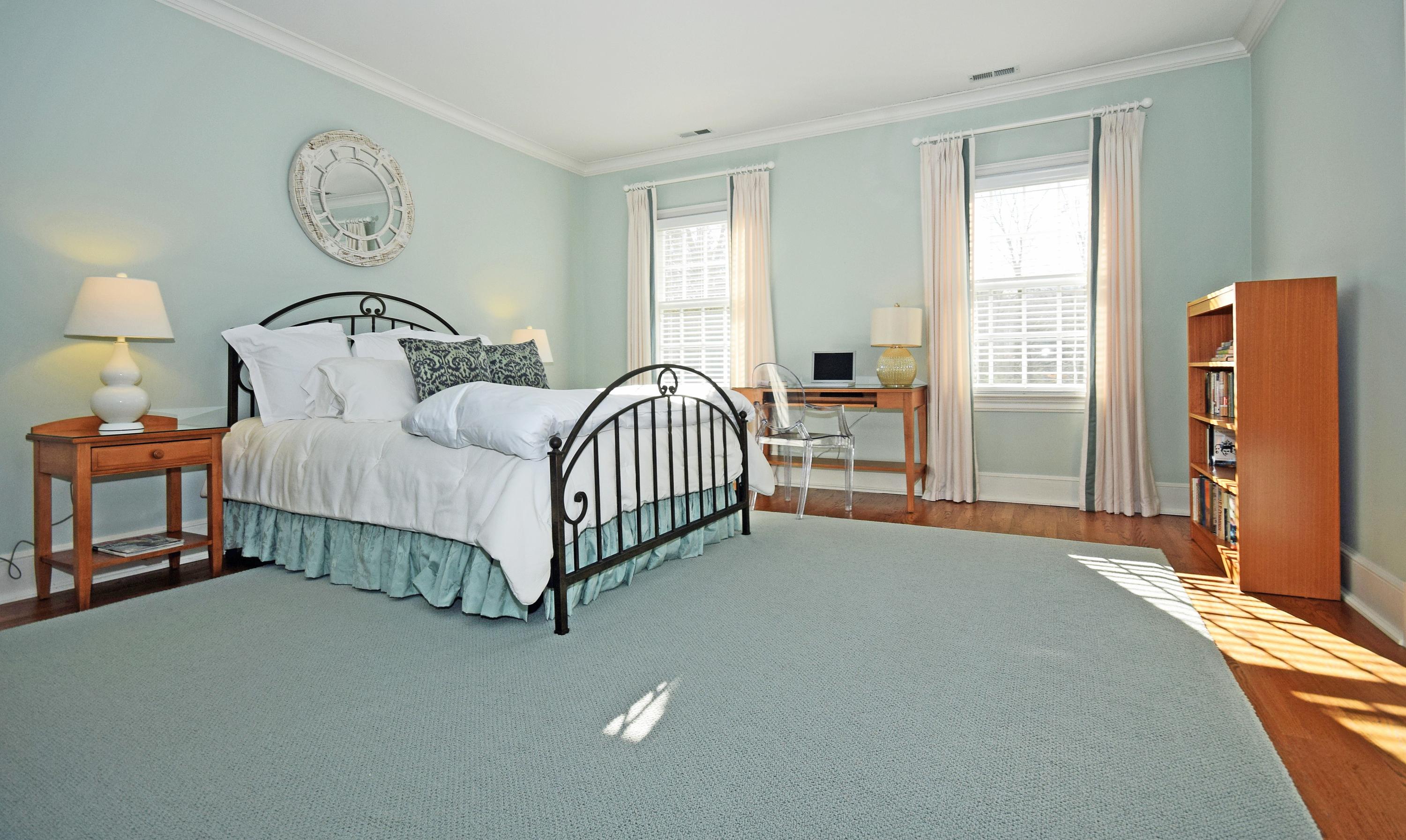 879 Valley Road New Canaan, CT 06840 - Photo 16 of 26 a bedroom with a bed and a window