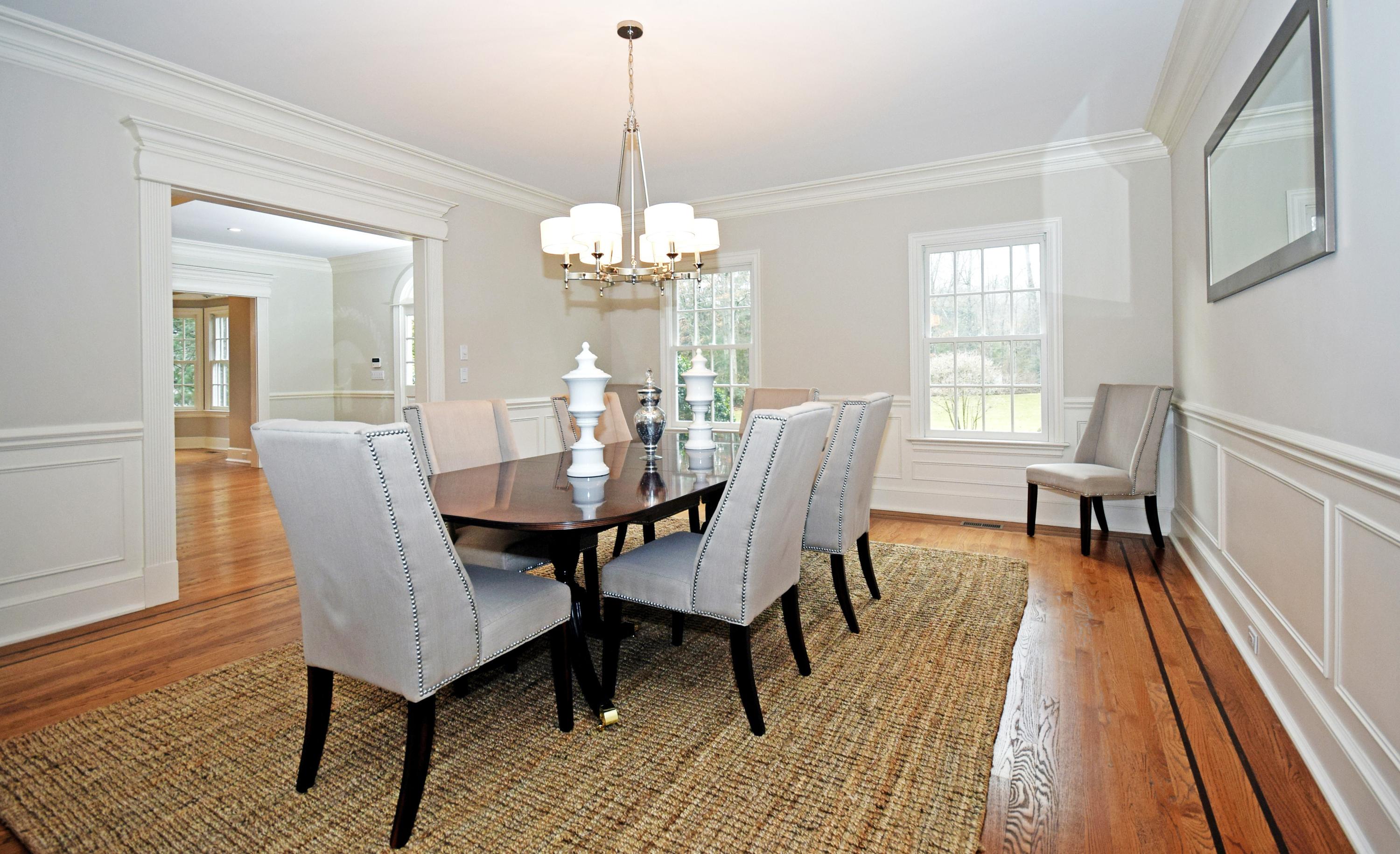879 Valley Road New Canaan, CT 06840 - Photo 7 of 26 a view of a dining room with furniture wooden floor and chandelier