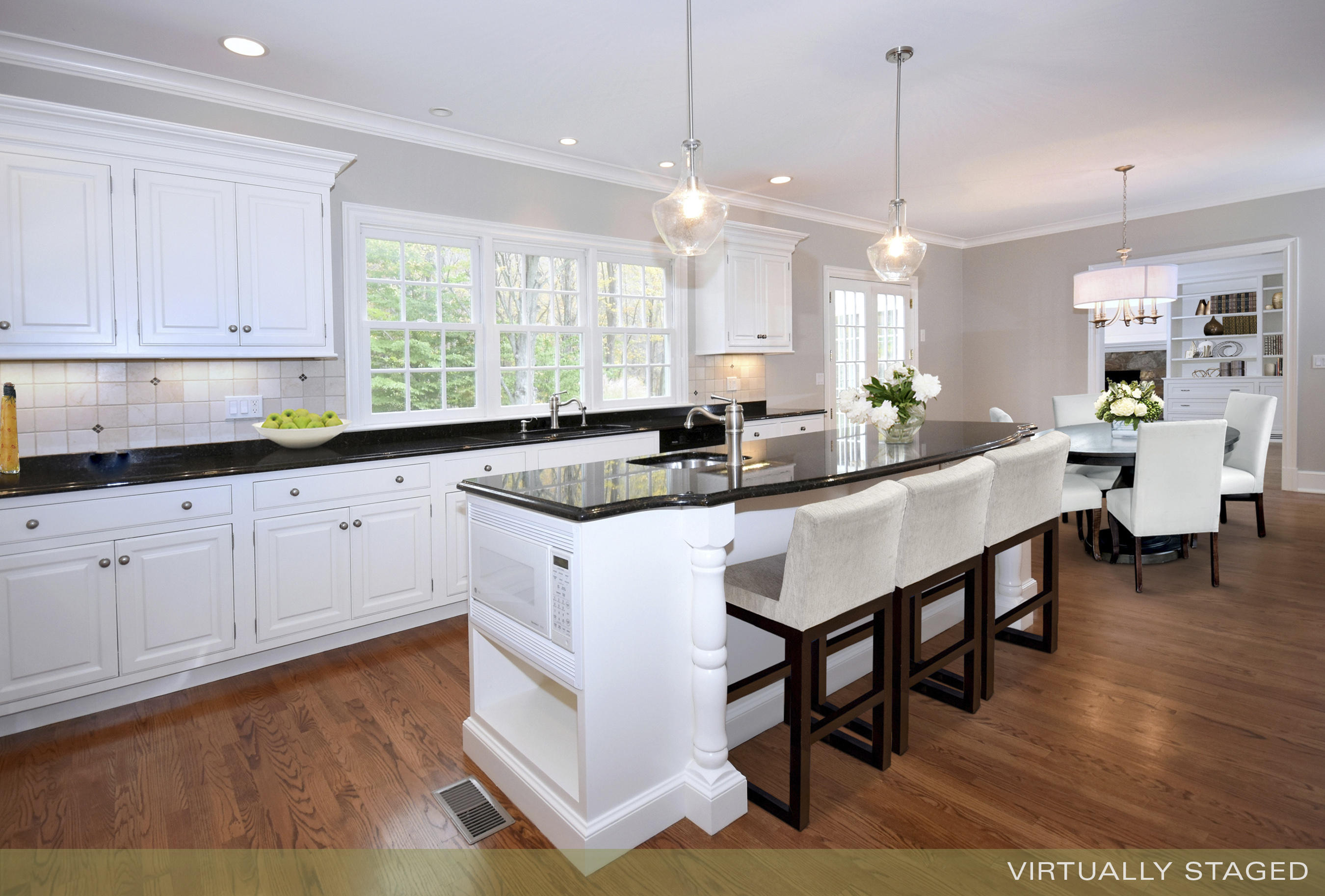 879 Valley Road New Canaan, CT 06840 - Photo 8 of 26 a kitchen with sink cabinets and wooden floor