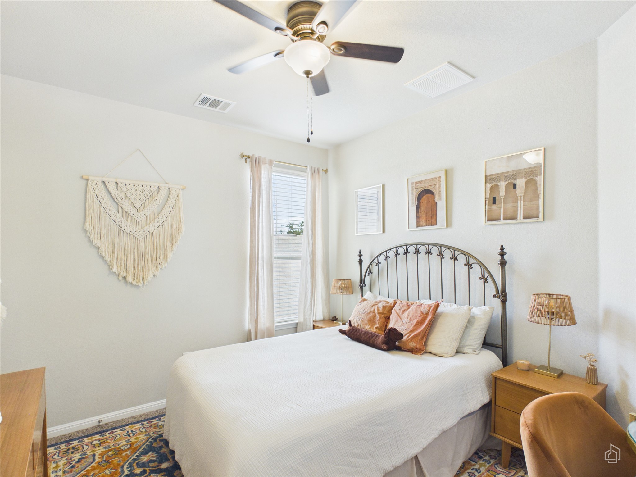 9310 Tanager Way Austin, TX 78748 - Photo 20 of 32 Well-lit sleeping quarters with a ceiling fan, windows with blinds, and decorative wall hangings.