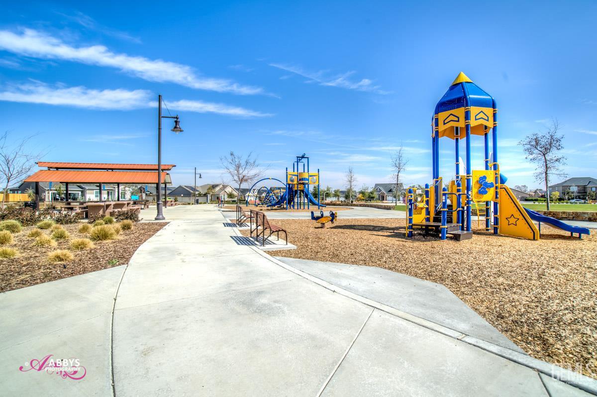 Undisclosed Address Shafter, CA 93263 - Photo 25 of 25 a view of a swimming pool with a bench