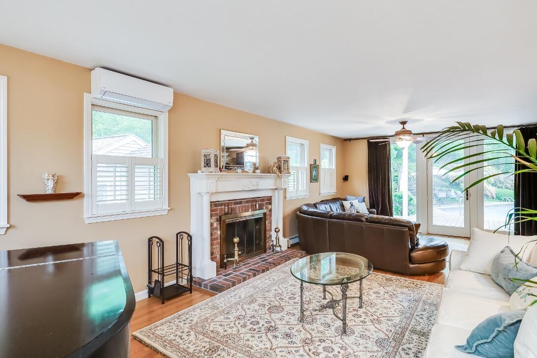 227 Run Hill Road Brewster, MA 02631 - Photo 11 of 89 a living room with furniture and a fireplace