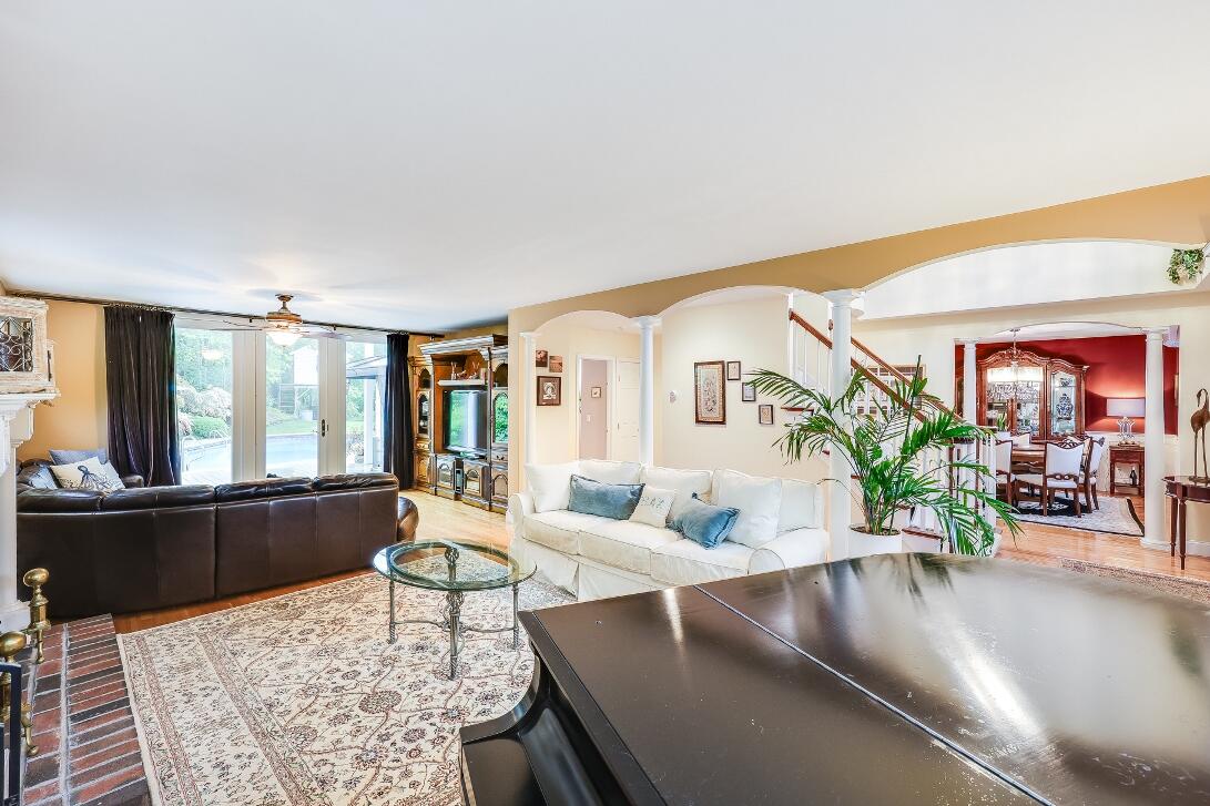 227 Run Hill Road Brewster, MA 02631 - Photo 13 of 89 a living room with furniture and large windows