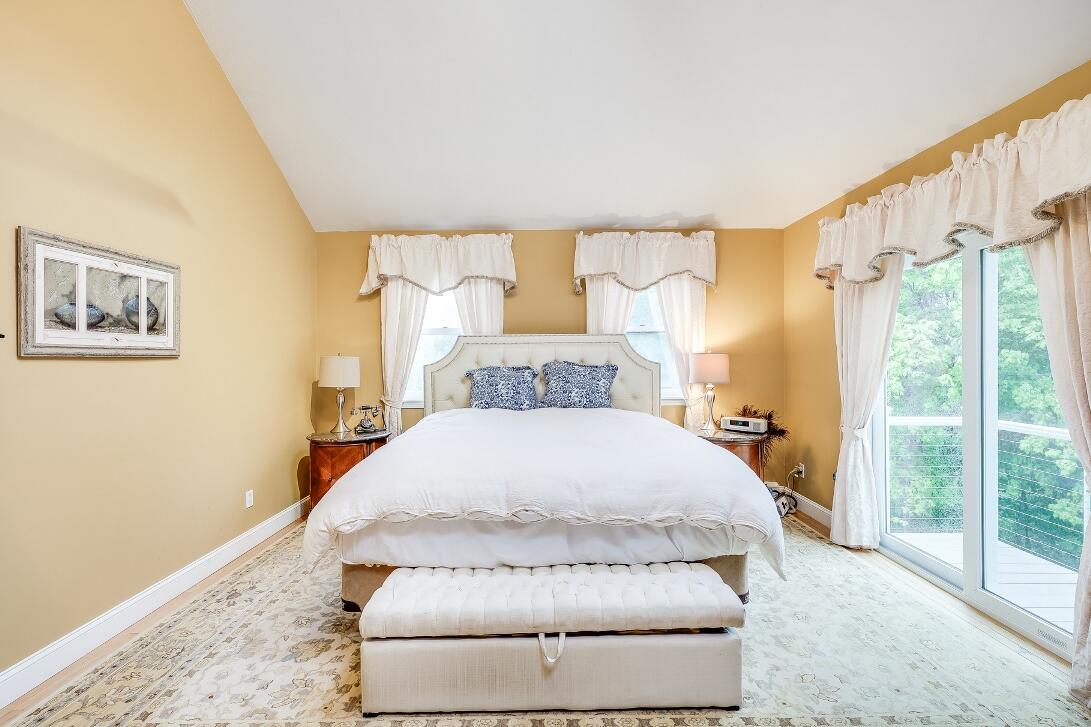 227 Run Hill Road Brewster, MA 02631 - Photo 36 of 89 a spacious bedroom with a bed and a window